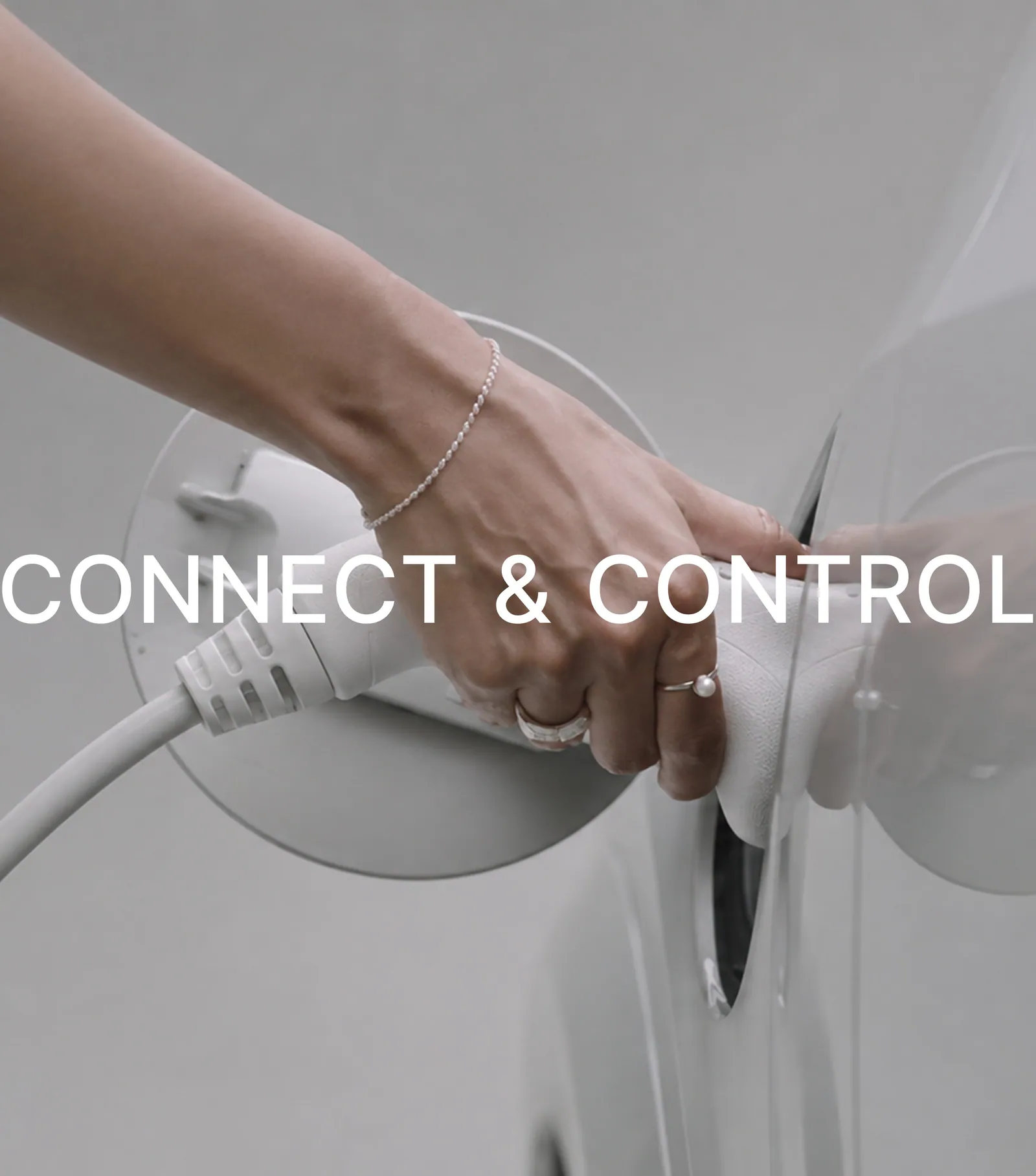 Hand connecting an electric vehicle charger